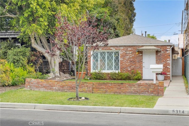 5314 E 4th St, Long Beach, CA 90814 - view of front facade featuring brick siding and a shingled roof