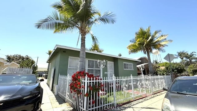 2224 Mortimer St, Huntington Park, CA 90255 - view of front facade with stucco siding and fence