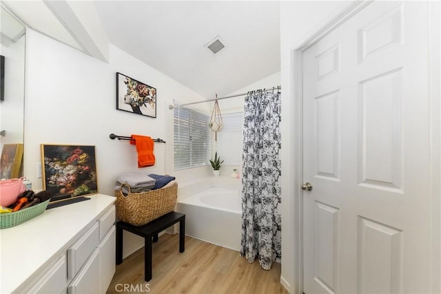10693 Berrywood Cir, Yucaipa, CA 92399 - bathroom with lofted ceiling, wood finished floors, and vanity