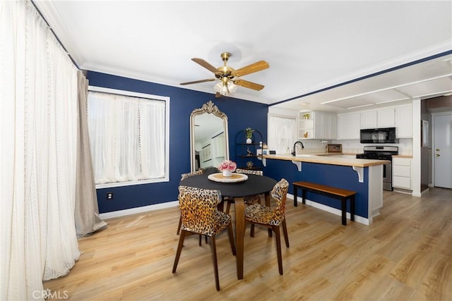 10693 Berrywood Cir, Yucaipa, CA 92399 - dining area featuring ceiling fan, light wood-type flooring, baseboards, arched walkways, and ornamental molding