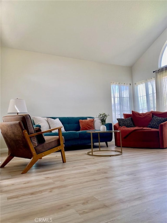 10693 Berrywood Cir, Yucaipa, CA 92399 - living room with light wood-style floors and vaulted ceiling
