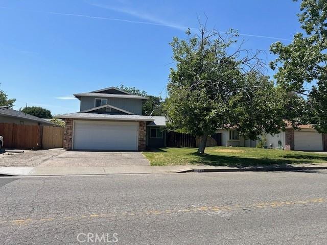 2729 Ceres Ave, Chico, CA 95973 - view of front of house featuring concrete driveway, a garage, and stone siding