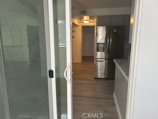 2729 Ceres Ave, Chico, CA 95973 - kitchen featuring stainless steel refrigerator with ice dispenser, wood finished floors, baseboards, and light countertops