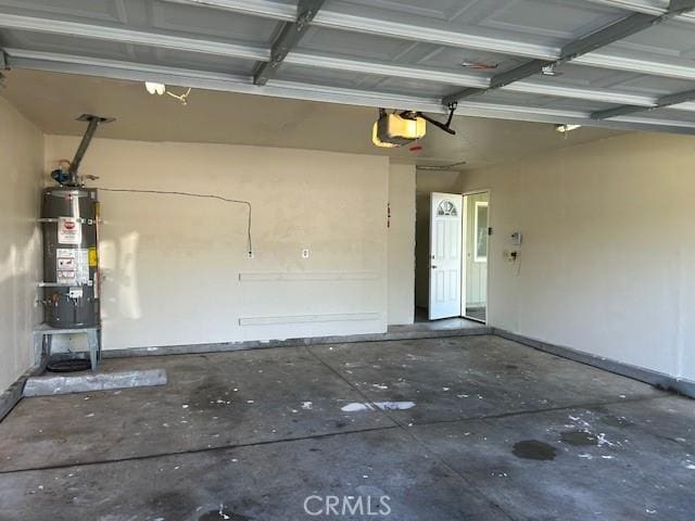 2729 Ceres Ave, Chico, CA 95973 - garage with strapped water heater and a garage door opener