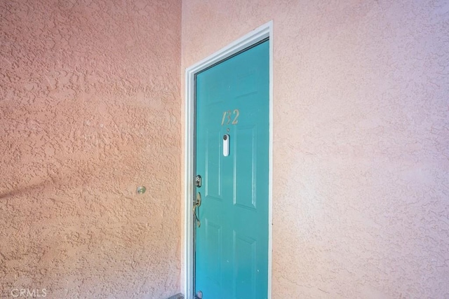 18213 Flynn Dr Unit 132, Canyon Country, CA 91387 - view of exterior entry with stucco siding