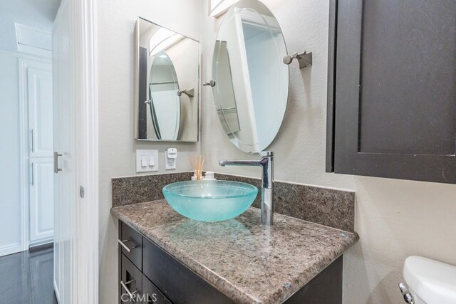 18213 Flynn Dr Unit 132, Canyon Country, CA 91387 - half bathroom featuring vanity and toilet