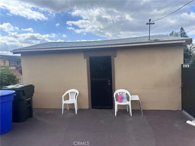 2248 Canterbury Ave, Pomona, CA 91768 - back of property featuring a patio, stucco siding, and a shingled roof