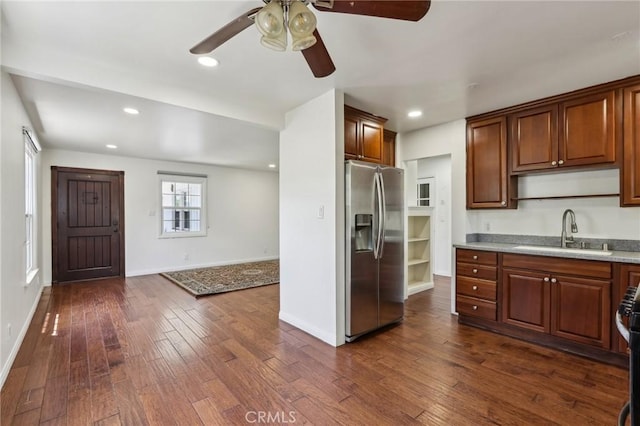 kitchen featuring stainless steel fridge, a sink, ceiling fan, dark wood-style floors, and recessed lighting