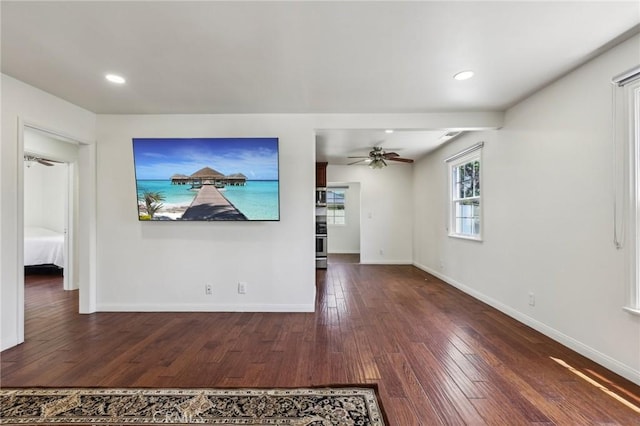 unfurnished living room with hardwood / wood-style flooring, baseboards, a ceiling fan, and recessed lighting