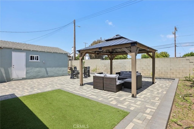 view of patio / terrace featuring a fenced backyard, an outdoor hangout area, and a gazebo