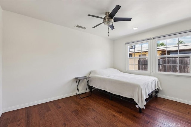 bedroom with wood finished floors, baseboards, multiple windows, a ceiling fan, and recessed lighting