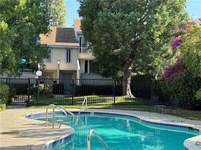 view of pool with fence