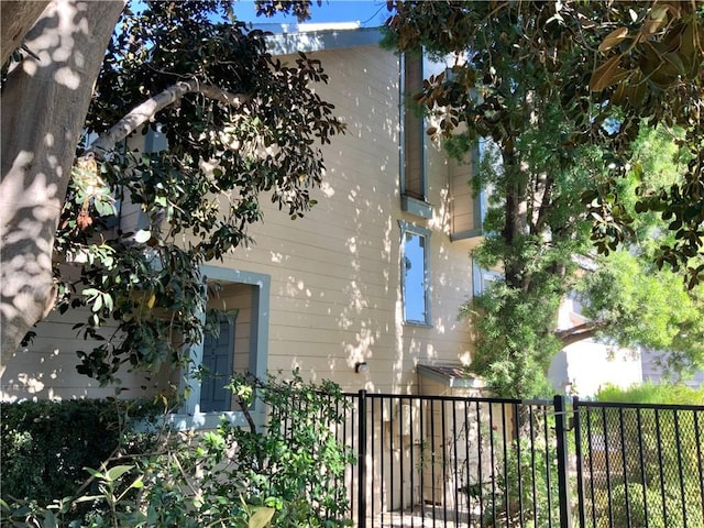 view of home's exterior with fence