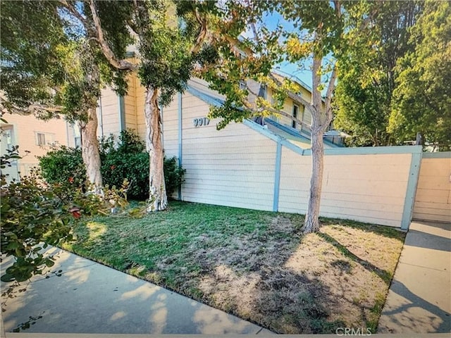 view of home's exterior featuring fence