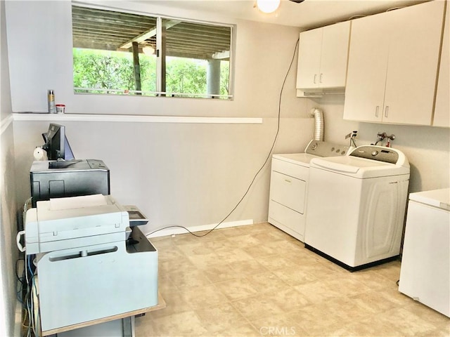washroom featuring cabinet space, independent washer and dryer, and plenty of natural light