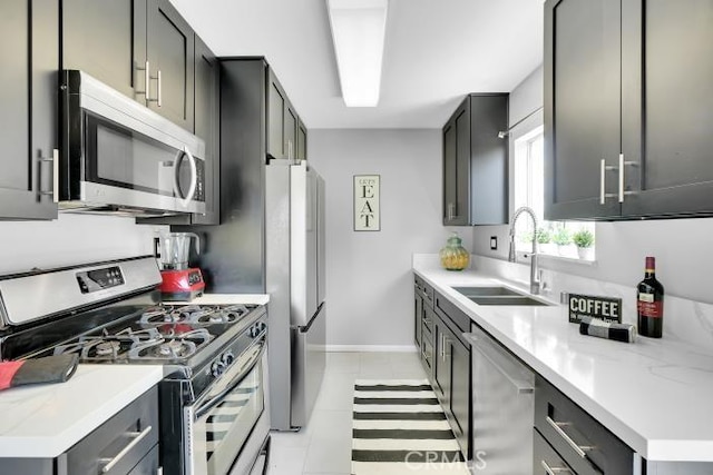 9917 Independence Ave Unit C, Chatsworth, CA 91311 - kitchen with appliances with stainless steel finishes, light countertops, and light tile patterned floors