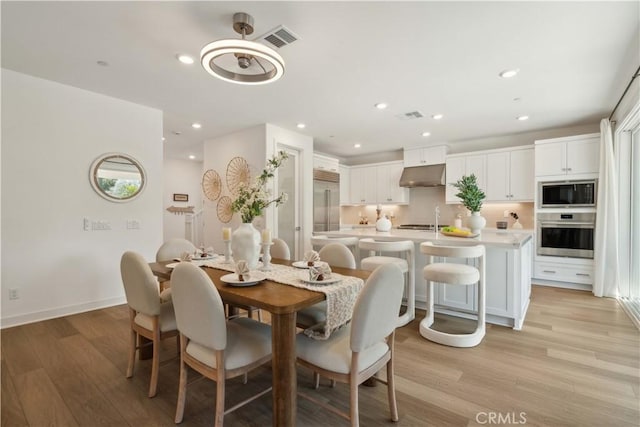 26288 Meadow Dr, San Juan Capistrano, CA 92675 - dining space with light wood-type flooring, recessed lighting, and baseboards