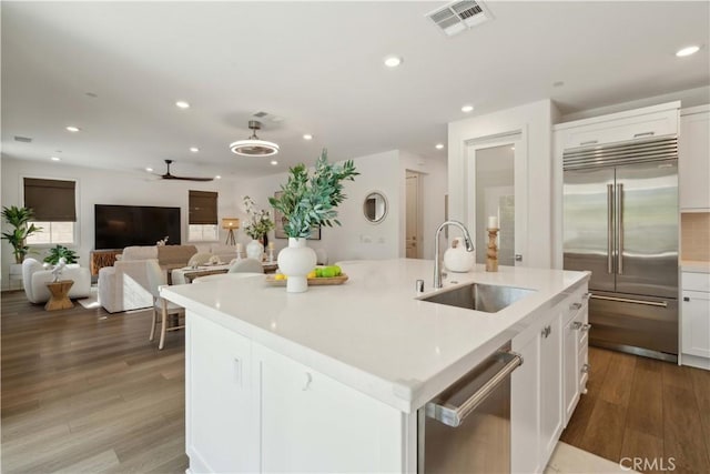 26288 Meadow Dr, San Juan Capistrano, CA 92675 - kitchen with a sink, stainless steel appliances, recessed lighting, wood finished floors, and ceiling fan