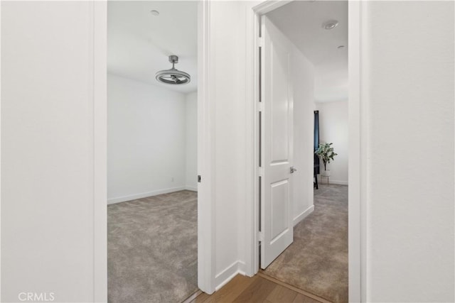 26288 Meadow Dr, San Juan Capistrano, CA 92675 - corridor featuring baseboards, carpet, and wood finished floors