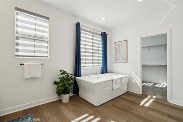 26288 Meadow Dr, San Juan Capistrano, CA 92675 - bathroom featuring wood finished floors, a soaking tub, baseboards, and recessed lighting