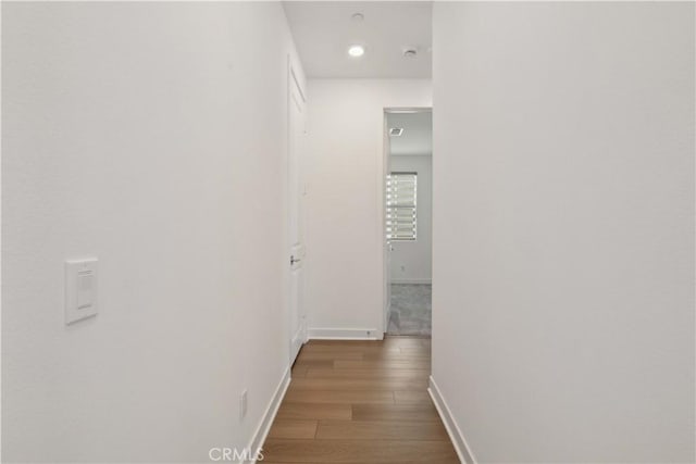 26288 Meadow Dr, San Juan Capistrano, CA 92675 - hallway featuring baseboards, wood finished floors, and recessed lighting