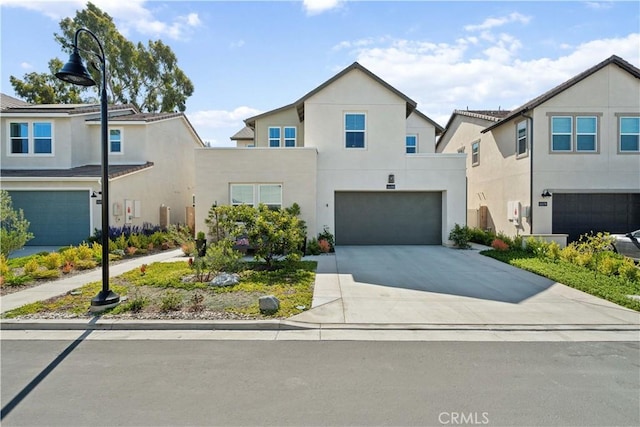 26288 Meadow Dr, San Juan Capistrano, CA 92675 - view of front facade featuring a garage, driveway, and stucco siding