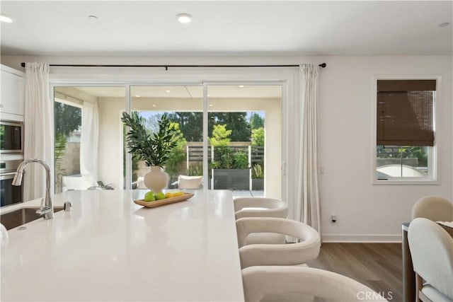 26288 Meadow Dr, San Juan Capistrano, CA 92675 - dining room featuring wood finished floors, baseboards, and healthy amount of natural light