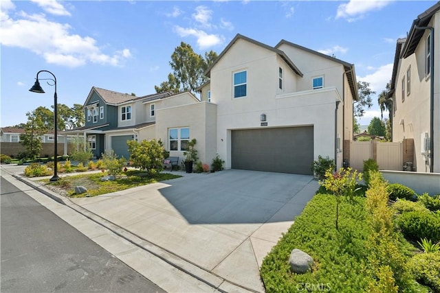 26288 Meadow Dr, San Juan Capistrano, CA 92675 - contemporary home with a garage, stucco siding, a residential view, and concrete driveway
