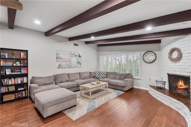 2485 San Mateo Dr, Upland, CA 91784 - living area with light wood-style flooring, beamed ceiling, a fireplace, and recessed lighting