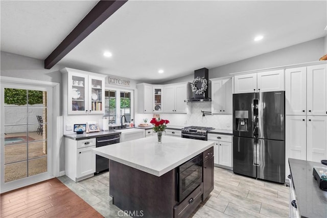 kitchen with refrigerator with ice dispenser, wall chimney exhaust hood, dishwasher, black microwave, and a sink