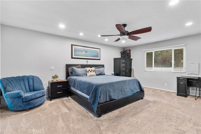 bedroom with light colored carpet, recessed lighting, baseboards, and ceiling fan