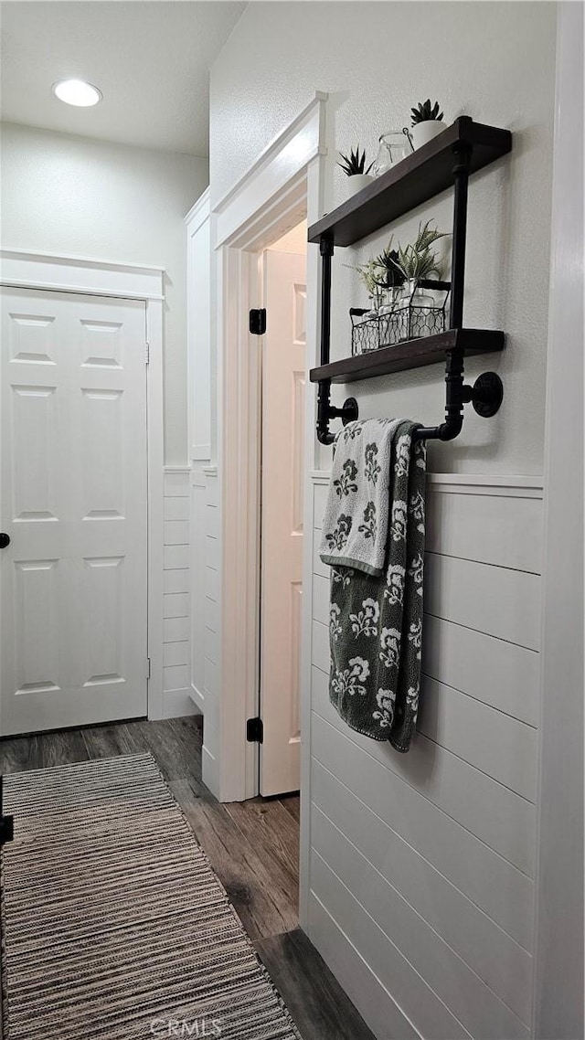13817 Grant Way, Oak Hills, CA 92344 - corridor with dark wood-style flooring and wainscoting