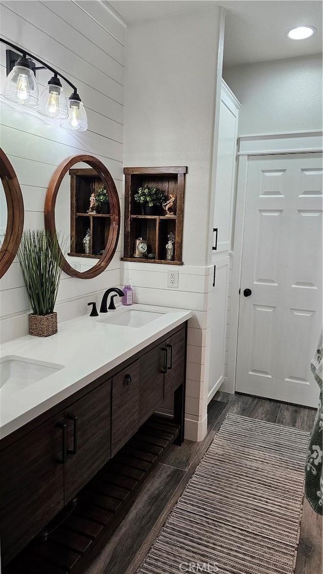 13817 Grant Way, Oak Hills, CA 92344 - full bath featuring double vanity, wood finished floors, and wooden walls