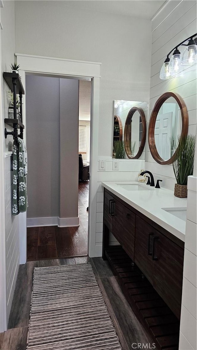 13817 Grant Way, Oak Hills, CA 92344 - bathroom featuring wood finished floors and double vanity