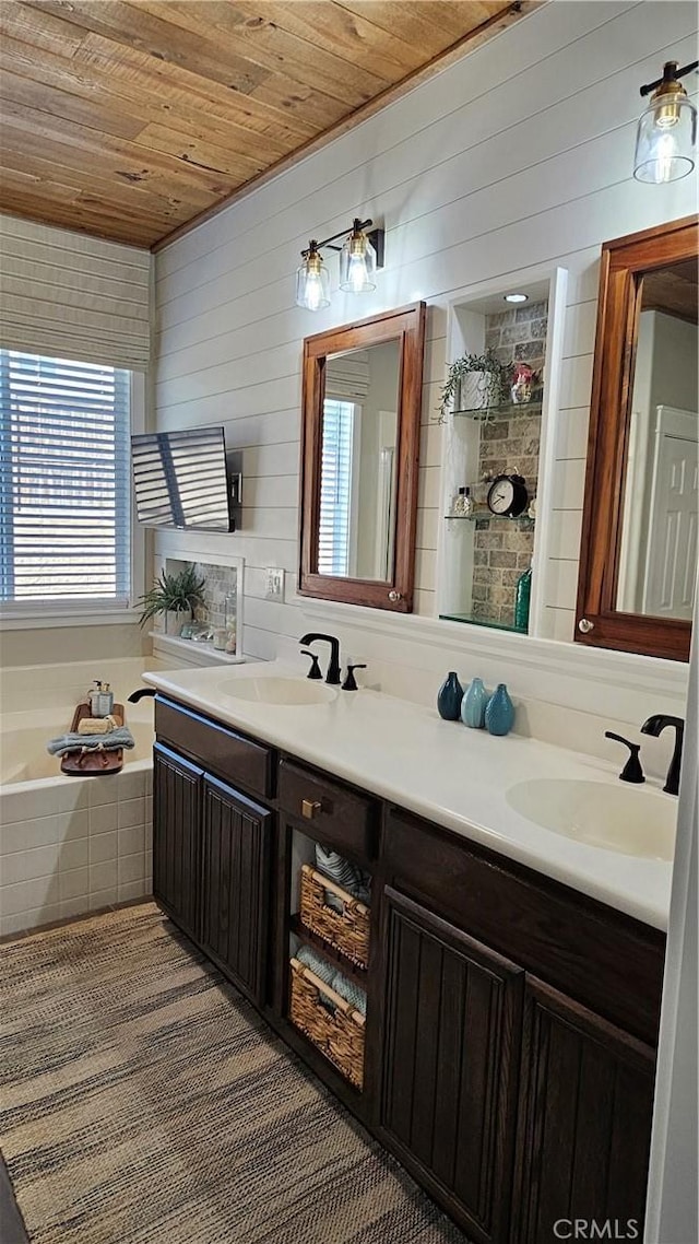 13817 Grant Way, Oak Hills, CA 92344 - full bath featuring wood ceiling, double vanity, wooden walls, and a garden tub