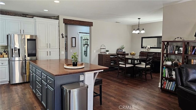 13817 Grant Way, Oak Hills, CA 92344 - kitchen featuring stainless steel fridge with ice dispenser, white cabinets, butcher block counters, recessed lighting, and dark wood finished floors