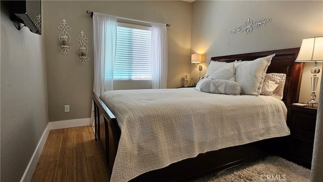 13817 Grant Way, Oak Hills, CA 92344 - bedroom with baseboards and wood finished floors