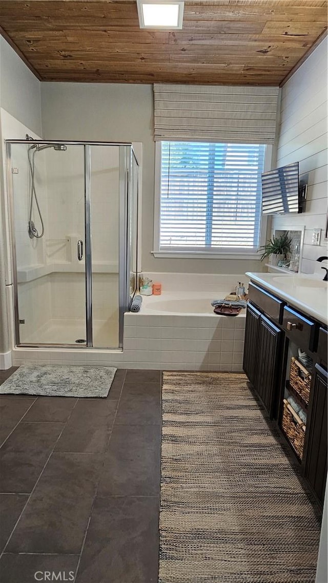 13817 Grant Way, Oak Hills, CA 92344 - full bath featuring wooden ceiling, a bath, a stall shower, and vanity
