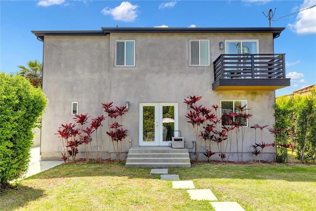 8910 S 3rd Ave, Inglewood, CA 90305 - back of property with a balcony, french doors, a lawn, stucco siding, and ac unit