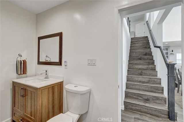 8910 S 3rd Ave, Inglewood, CA 90305 - bathroom with toilet, vanity, and baseboards