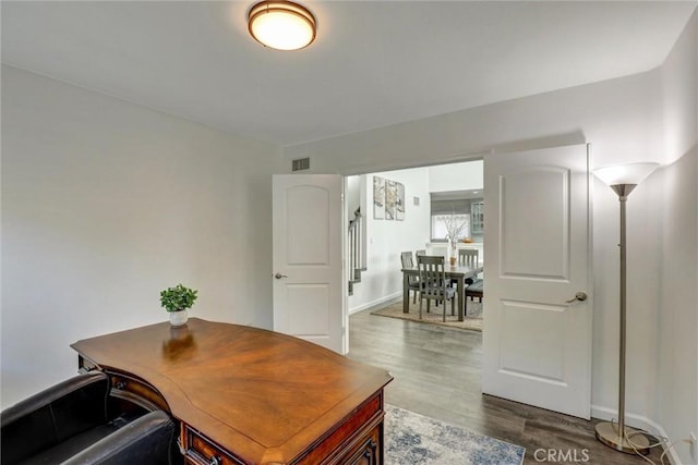 8910 S 3rd Ave, Inglewood, CA 90305 - office area featuring dark wood-style flooring and baseboards
