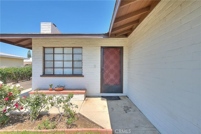 321 Aguirre Ln, Placentia, CA 92870 - view of exterior entry featuring a chimney