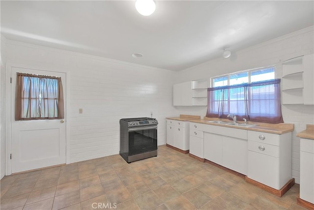 321 Aguirre Ln, Placentia, CA 92870 - kitchen with open shelves, gas range, a sink, crown molding, and white cabinetry