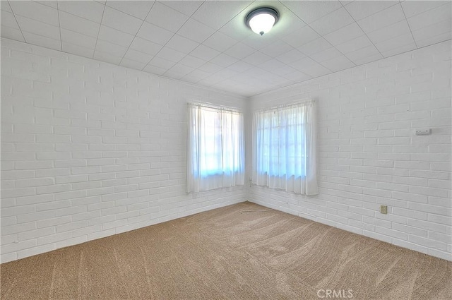 321 Aguirre Ln, Placentia, CA 92870 - spare room with carpet floors and brick wall