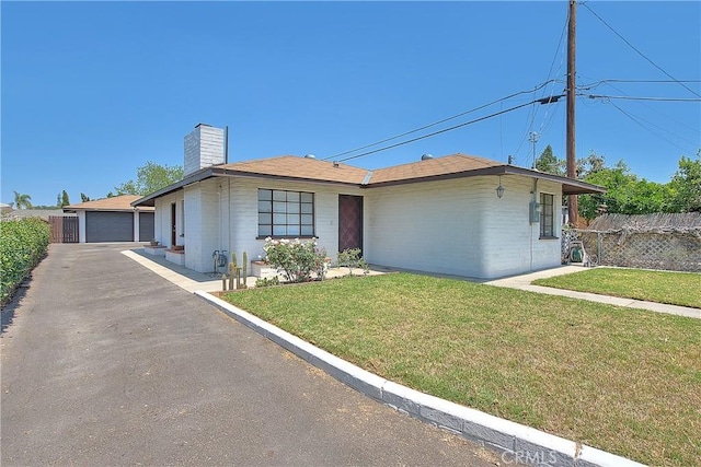 321 Aguirre Ln, Placentia, CA 92870 - ranch-style house with a chimney and a garage