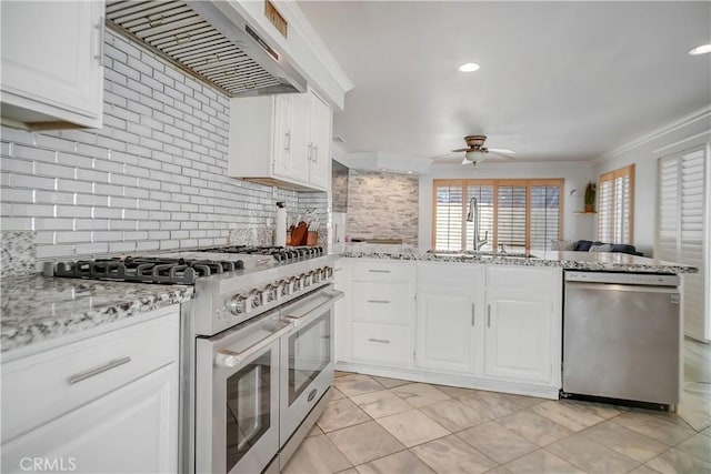 kitchen featuring appliances with stainless steel finishes, extractor fan, a sink, a ceiling fan, and crown molding