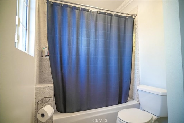 bathroom featuring toilet and shower / bathtub combination with curtain
