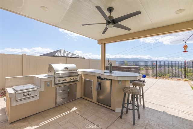 41215 Alegria Ln, Lake Elsinore, CA 92532 - view of patio / terrace featuring area for grilling, exterior kitchen, and a fenced backyard