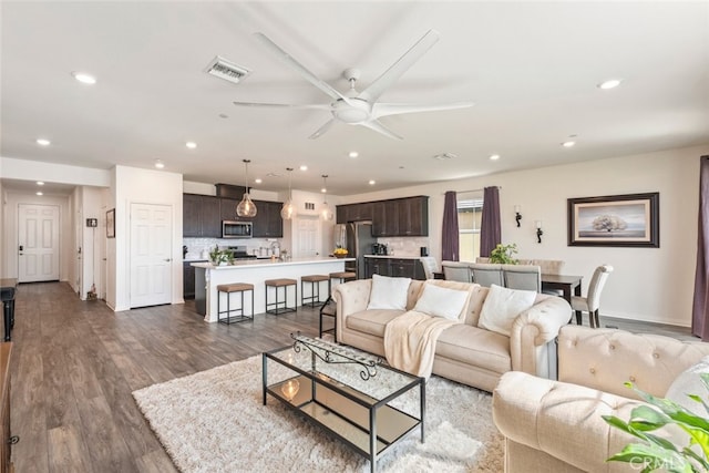 41215 Alegria Ln, Lake Elsinore, CA 92532 - living room with recessed lighting, a ceiling fan, dark wood-type flooring, and baseboards