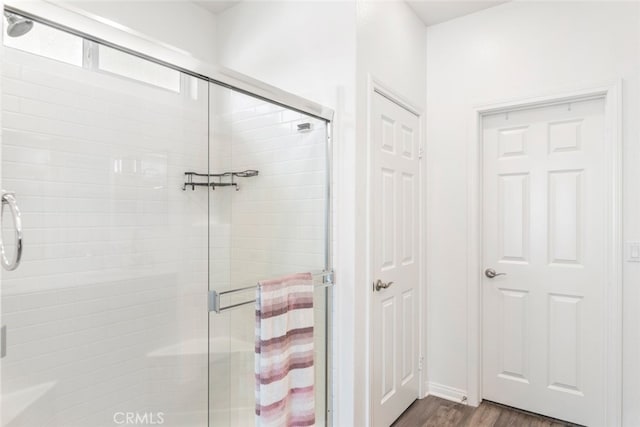 41215 Alegria Ln, Lake Elsinore, CA 92532 - bathroom featuring a stall shower and wood finished floors